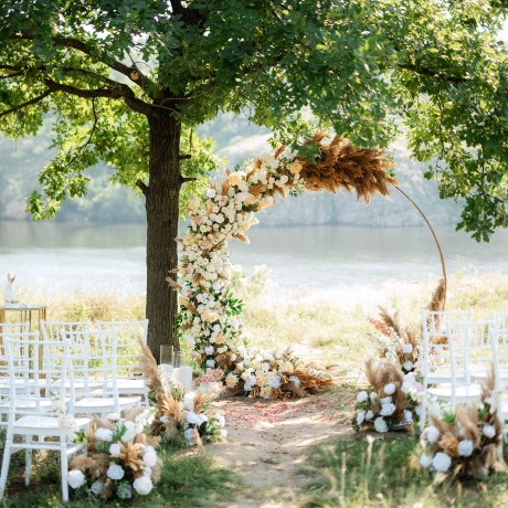 wedding ceremony area with dried flowers in a meadow in a forest