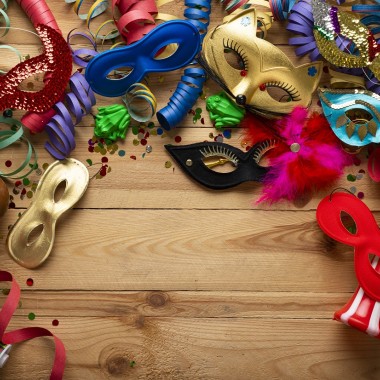 carnival-background-on-a-wooden-surface-masks-co-2023-11-27-05-33-07-utc